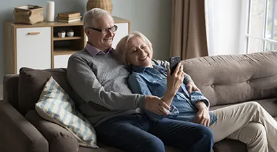 Senior couple at home with Locksure door security monitoring