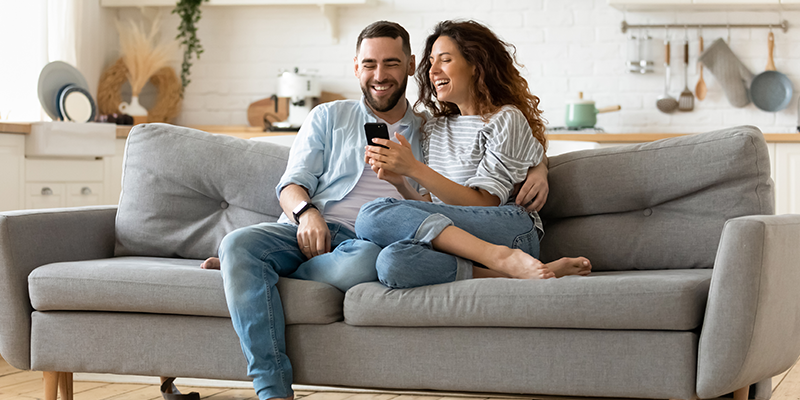 Family using smartphone to check Locksure home security system together