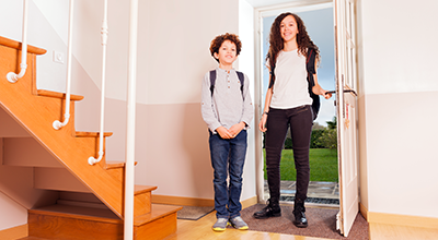 Teenager arriving home safely with Locksure security notification