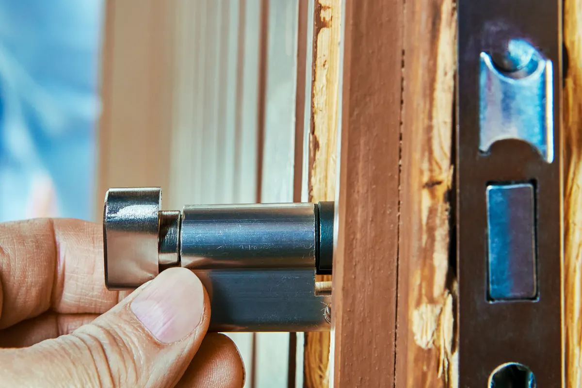 A euro cylinder being handled - the lock change Locksure does not require